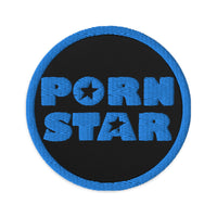 Circular embroidered patch featuring Porn Star Logo, front view
