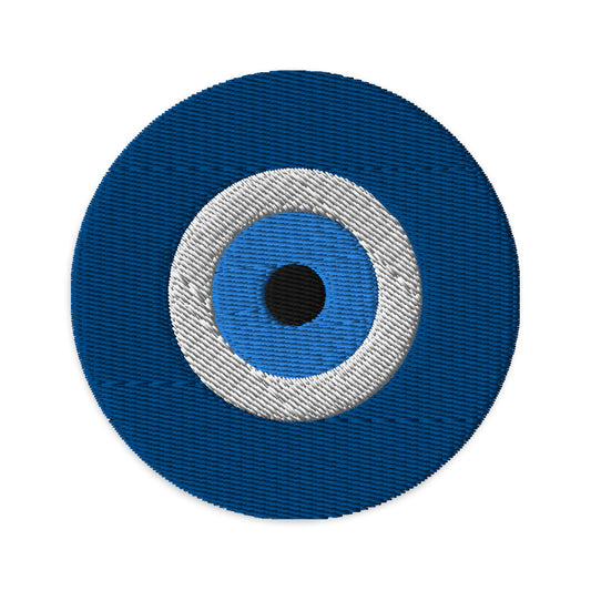 Circular embroidered patch featuring The Evil Eye, front view