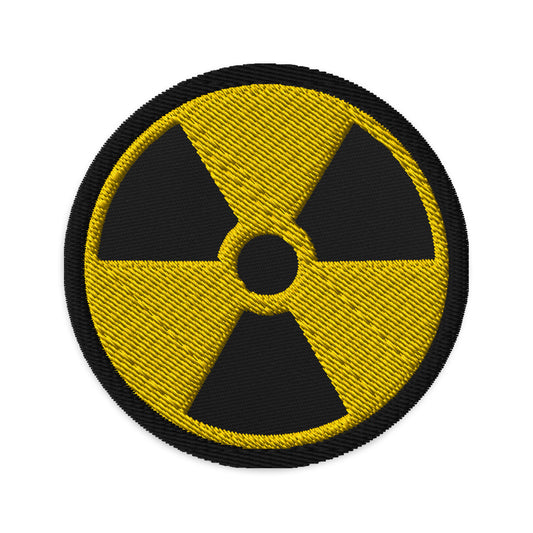 Circular embroidered patch featuring Radioactive Sign, front view