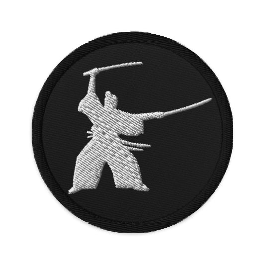 Circular embroidered patch featuring Samurai Two Sword Technique, front view