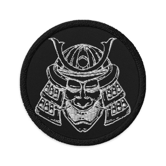 Circular embroidered patch featuring Samurai Warrior Mask, front view