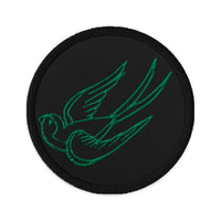Circular embroidered patch featuring Falling Sparrow Tattoo Style Bird, front view