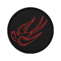 Circular embroidered patch featuring Falling Sparrow Tattoo Style Bird, front view