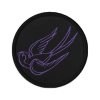 Circular embroidered patch featuring Falling Sparrow Tattoo Style Bird, front view
