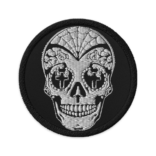 Circular embroidered patch featuring Dia De Los Muertos Day of the Dead Sugar Skull, front view