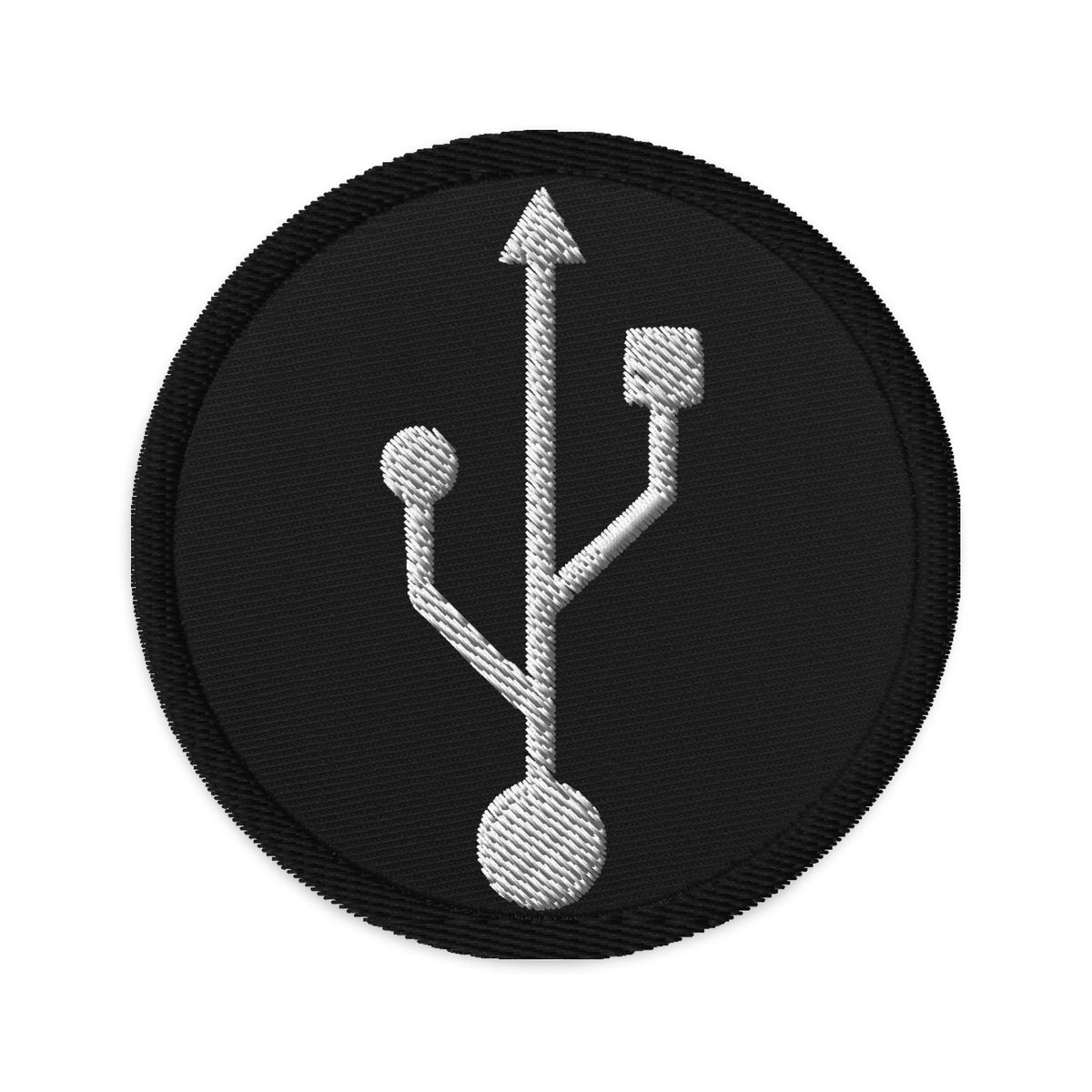 Circular embroidered patch featuring USB Symbol, front view