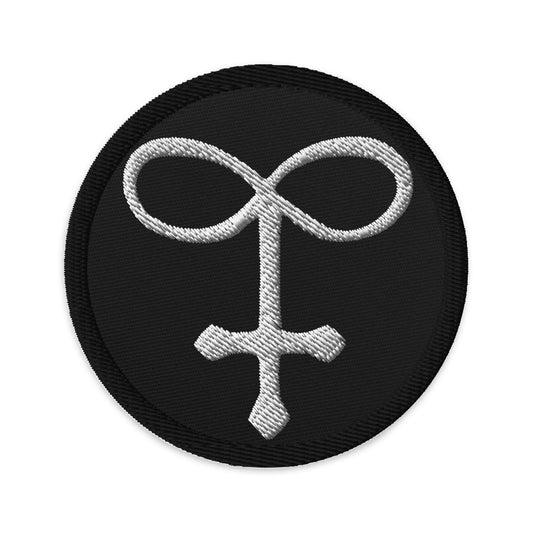 Circular embroidered patch featuring Alchemy Glass, front view