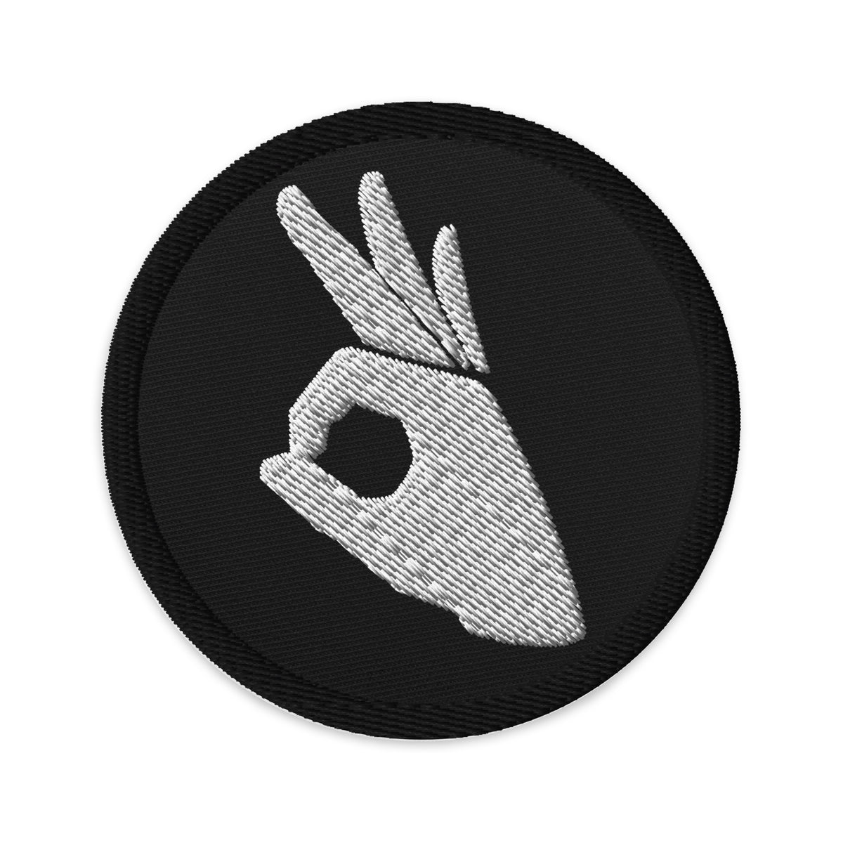 Circular embroidered patch featuring Okay Sign Hand Gesture Symbol, front view