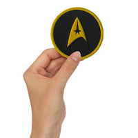 Circular embroidered patch featuring The Delta Insignia Starfleet Badge, front view