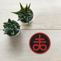 Circular embroidered patch featuring Red The Leviathan Cross of Satan, front view