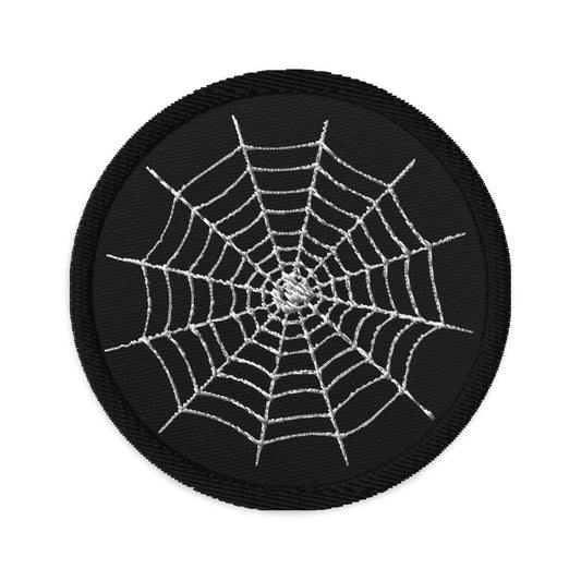 Circular embroidered patch featuring Creepy Spiderweb Halloween, front view