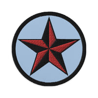 Circular embroidered patch featuring Black Nautical Star North Star, front view