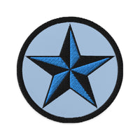 Circular embroidered patch featuring Black Nautical Star North Star, front view