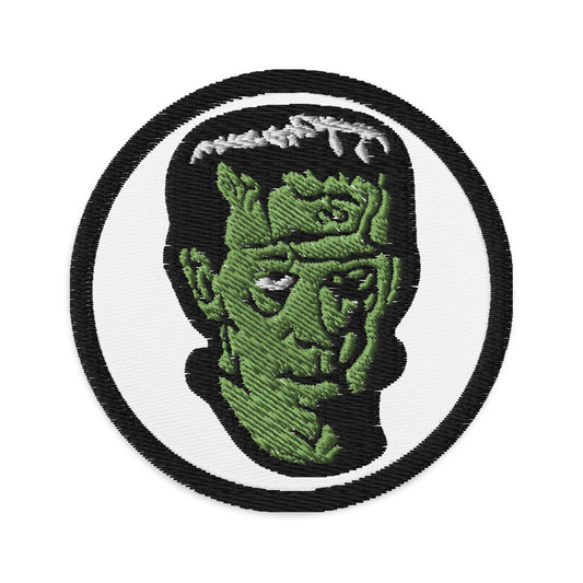 Circular embroidered patch featuring The Modern Prometheus Dr. Frankenstein's Monster, front view