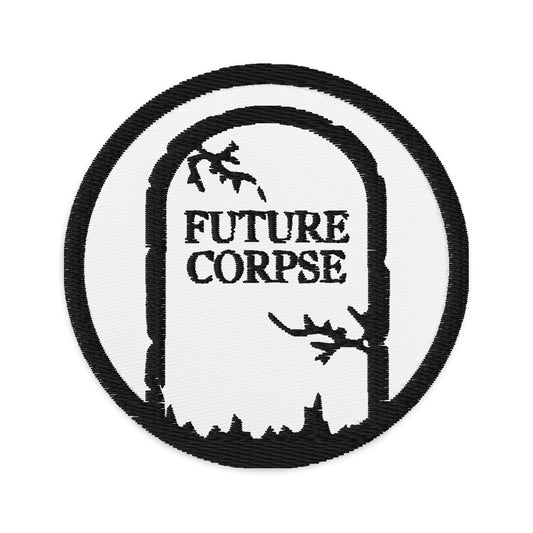 Circular embroidered patch featuring Tomb Stone Future Corpse, front view