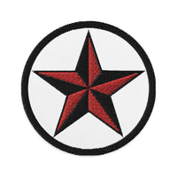 Circular embroidered patch featuring Black Nautical Star North Star, front view