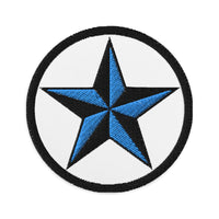 Circular embroidered patch featuring Black Nautical Star North Star, front view