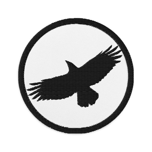 Circular embroidered patch featuring Flying Raven Black Bird, front view