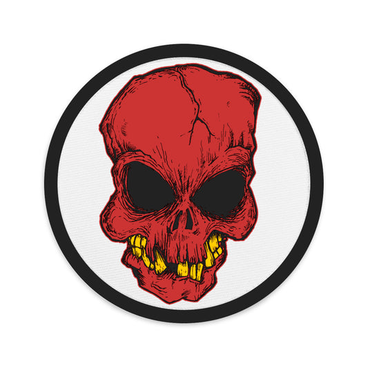 Circular embroidered patch featuring Broken Creepy Skull, front view