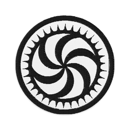 Circular embroidered patch featuring Deadly Swirl Spike, front view