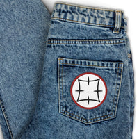 Circular embroidered patch featuring Ancient Japanese Anime Symbol, front view