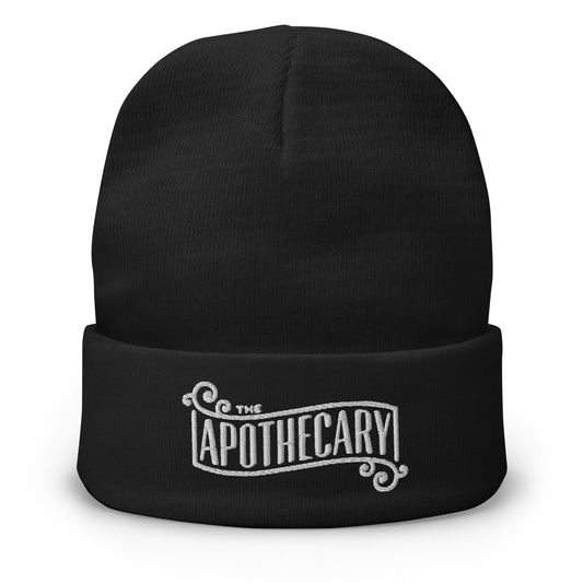 Black cuffed beanie with The Apothecary embroidered artwork, front view