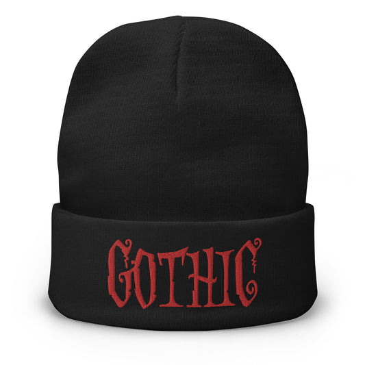 Black cuffed beanie with Dramatic embroidered artwork, front view