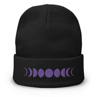 Black cuffed beanie with Moon Phases Lunar Cycle to Full Moon embroidered artwork, front view