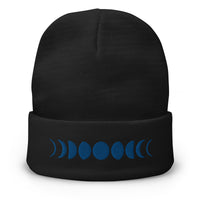 Black cuffed beanie with Moon Phases Lunar Cycle to Full Moon embroidered artwork, front view