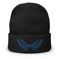 Black cuffed beanie with Falling Sparrows Tattoo Bird embroidered artwork, front view