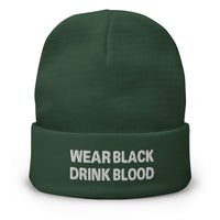 Green cuffed beanie with Wear Black Drink Blood embroidered artwork, front view