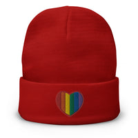 Red cuffed beanie with Gay Pride Rainbow Colors Heart embroidered artwork, front view