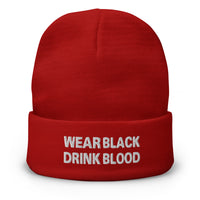 Red cuffed beanie with Wear Black Drink Blood embroidered artwork, front view